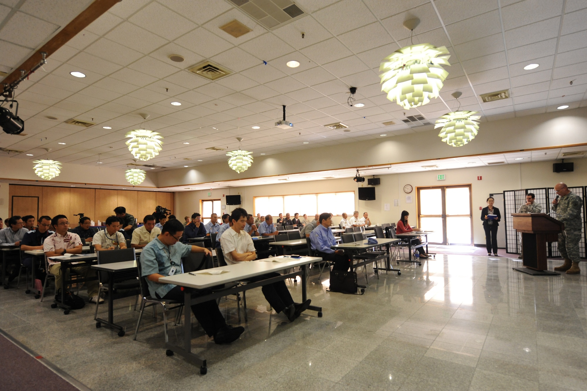 U.S. Army Col. David W. DeTata, U.S. Forces Japan, Okinawa Area Field Office chief,  speaks at a tabletop exercise about what would happen in the event of an off base U.S. military aircraft accident in Japan on Kadena Air Base, Nov. 13, 2014. The Bilateral Aircraft Mishap Response exercise answered any questions and made sure each agency knew their role for the field training exercise scheduled for Feb. 2015. (U.S. Air Force photo by Airman 1st Class Stephen G. Eigel/Released)