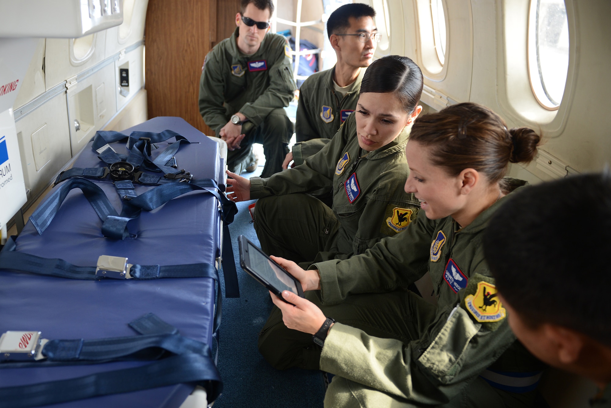 Airmen from the 18th Aeromedical Evacuation Squadron review procedures for the full spectrum hospital bed aboard a C-12 Huron during Exercise Keen Sword 2015 at Kadena Air Base, Japan, Nov. 12, 2014. This training between the U.S. and Japan has been a routine, recurring event since 1986. (U.S. Air Force photo by Airman 1st Class David C. Danford/Released)
