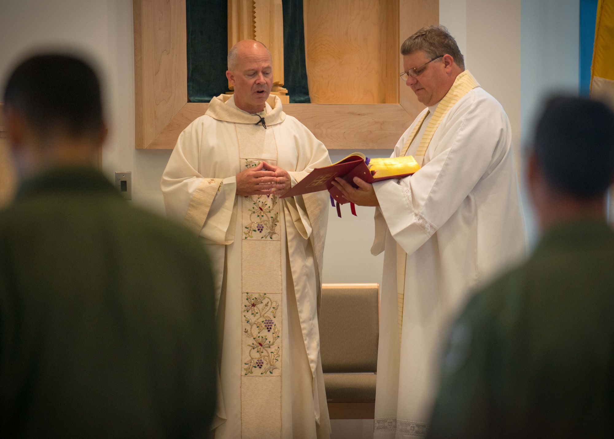 U.S. Air Force Maj. Chad Zielinski, the 354th Fighter Wing deputy wing chaplain, reads from the bible during a service at Eielson Air Force Base, Alaska, Aug. 15, 2014. Pope Francis appointed Zielinski to become the new bishop of the Catholic Diocese of Fairbanks. (U.S. Air Force photo by Tech. Sgt. Joseph Swafford)