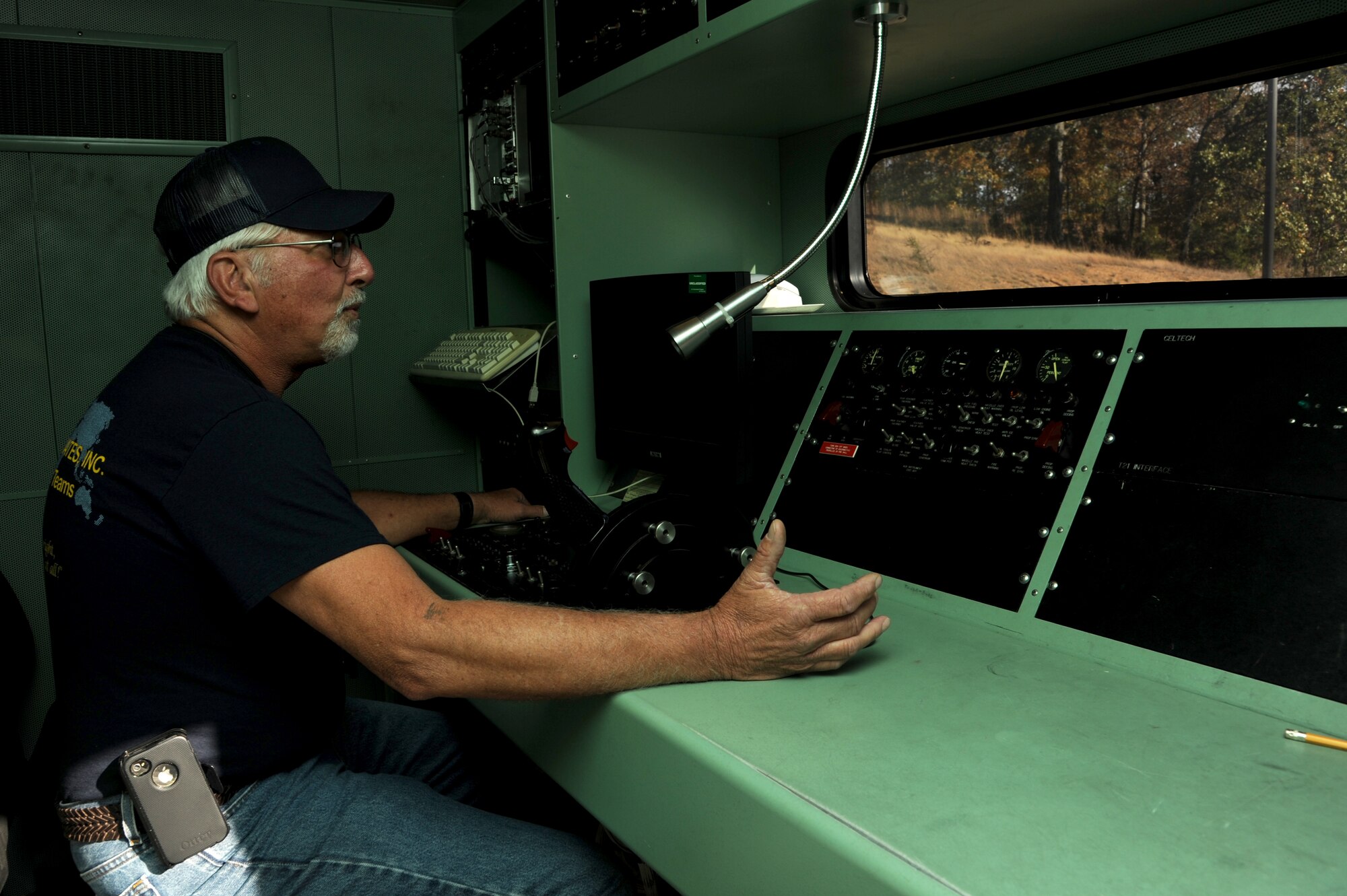 Danny Gregg, a 19th Maintenance Squadron contractor and test cell lead, operates the test cell Oct. 27, 2014, at Little Rock Air Force Base, Ark. In the test cell, Gregg operates a machine that tests the T-56 engines used in C-130s from a remote facility that simulates C-130 aircraft controls. (U.S. Air Force photo by Airman 1st Class Mercedes Muro)