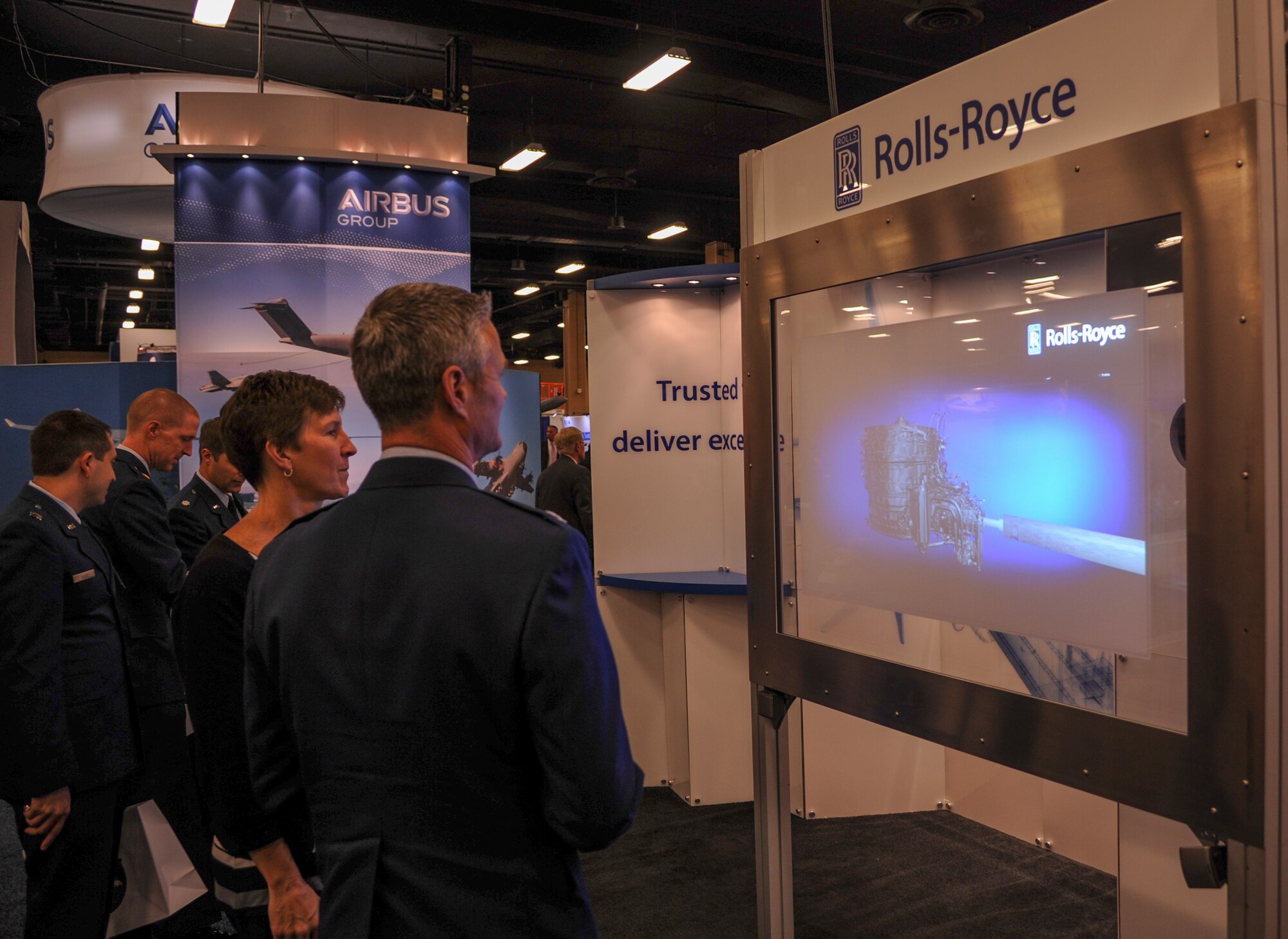 Air Mobility Command members tour the Rolls-Royce avionic technology exhibit Nov. 1, 2014 at the Airlift/Tanker’s Association Technology Exposition in Nashville, Tenn. Representatives of more than 50 companies attended the expo to show how their products and services contribute to AMC’s global mission. (U.S. Air Force photo/Airman 1st Class Harry Brexel/Released)