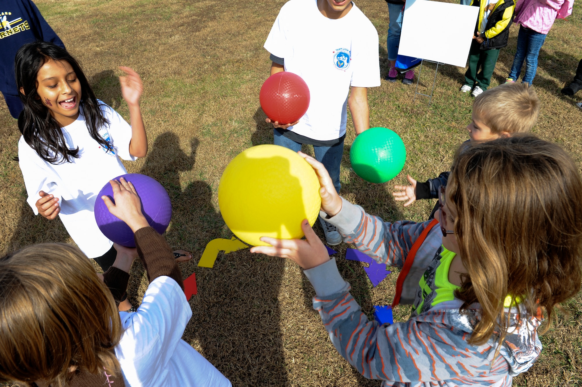 Children participate in the Wonderball game during the Month of the Military Family event Nov. 8, 2014, at Little Rock Air Force Base, Ark. The event hosted units from across the base, providing specialized demonstrations, games and contests for military families. (U.S. Air Force photo by Staff Sgt. Jessica Condit)