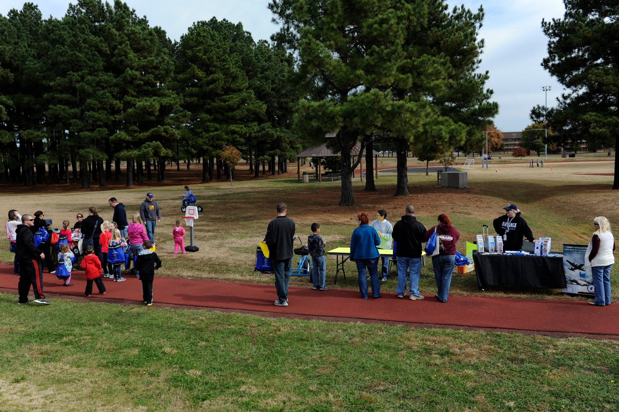 Military families visit the Family Advocacy and Alcohol Drug Abuse Prevention booths during the Month of the Military Family event Nov. 8, 2014, at Little Rock Air Force Base, Ark. The event, hosted by the Airman and Family Readiness Center, provided information and entertainment for military family members. (U.S. Air Force photo by Staff Sgt. Jessica Condit)