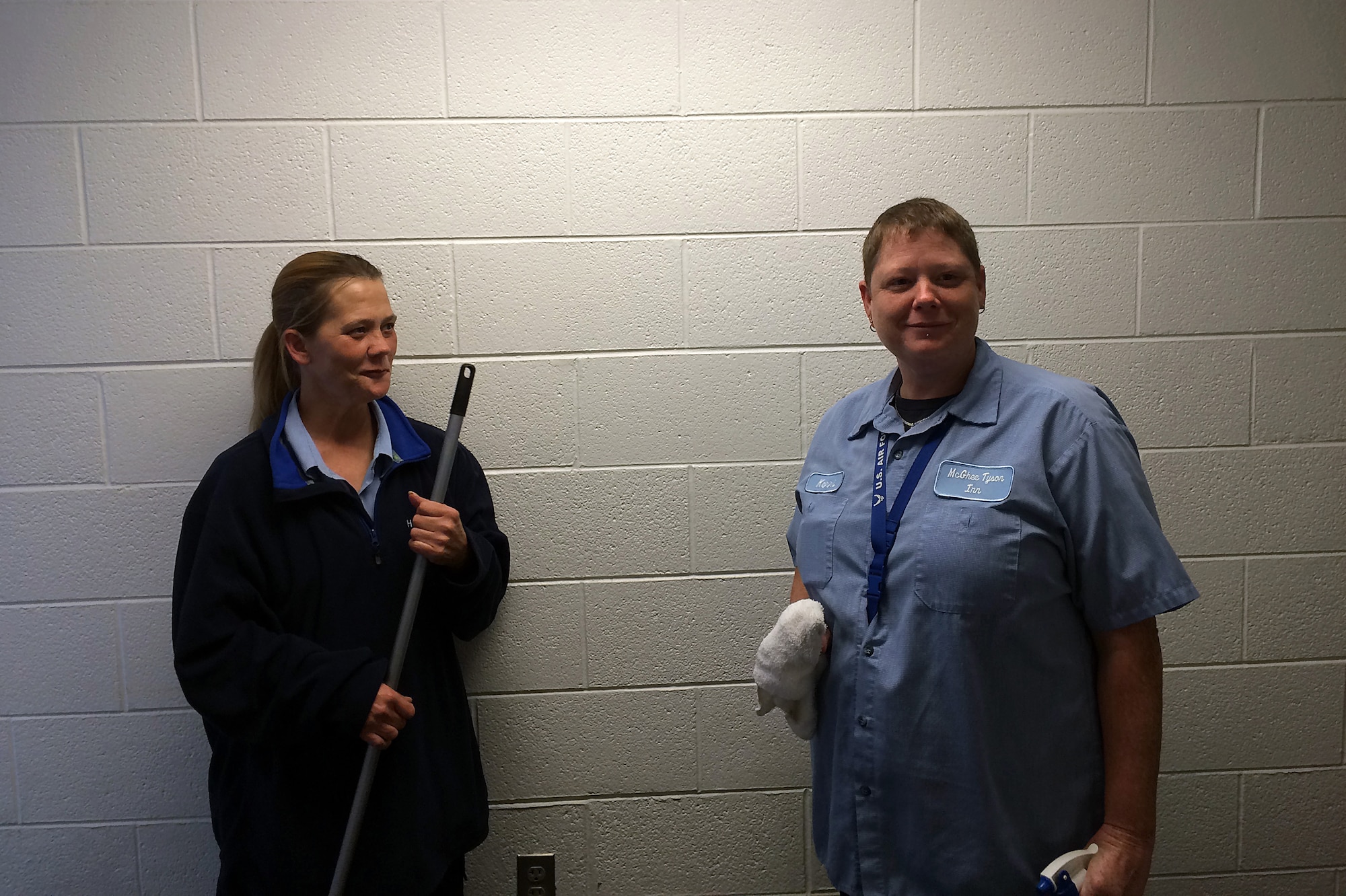 MCGHEE TYSON AIR NATIONAL GUARD BASE, Tenn. - A wasp in one of the laundry rooms causes a quick evacuation for housekeepers, from left, Michelle Chavis and Kerri Hurst. An Airman nearby came to their aid and got rid of the pest using his hat here Nov. 7, 2014, at the McGhee Tyson Inn. (U.S. Air National Guard photo by Master Sgt. Mike R. Smith/Released)