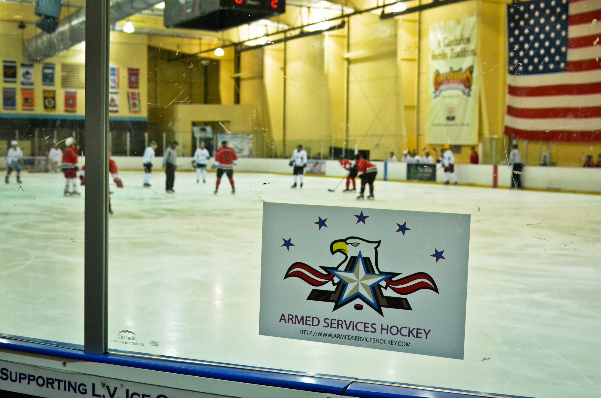 The Brew City Tankers, a hockey team representing the 128th Air Refueling Wing, line up against the Badger Militia, a hockey team representing the 115th Fighter Wing and Wisconsin Joint Force Headquarters, at the 2014 Armed Services Hockey Tournament at the Sobe Ice Arena in Las Vegas Nov. 8, 2014.  (U.S. Air National Guard photo by Staff Sgt. Jenna V. Lenski/Released)
