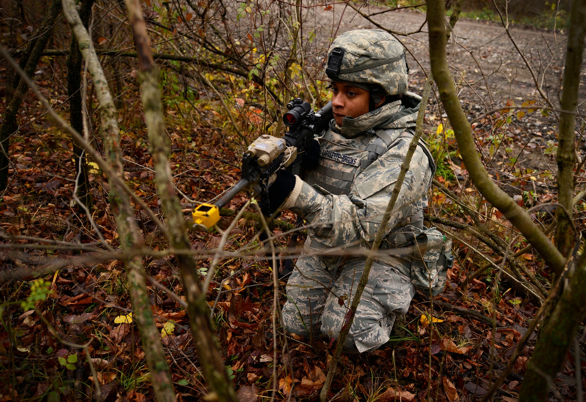 An Airman from the 914th Security Forces Squadron provides security for Airmen of 914th Explosive Ordnance Disposal Squadron during a joint exercise with the 914th Security Forces Squadron, at the Niagara Falls Air Reserve Station N.Y., November 1, 2014. Members of the 914th EOD, along with personnel from the 914th Security Forces Squadron participated in the day-long exercise which combined the unique expeditionary combat skills of each squadron and allowed members the opportunity to observe the other’s practices and procedures. (U.S. Air Force photo by Staff Sgt. Stephanie Sawyer)