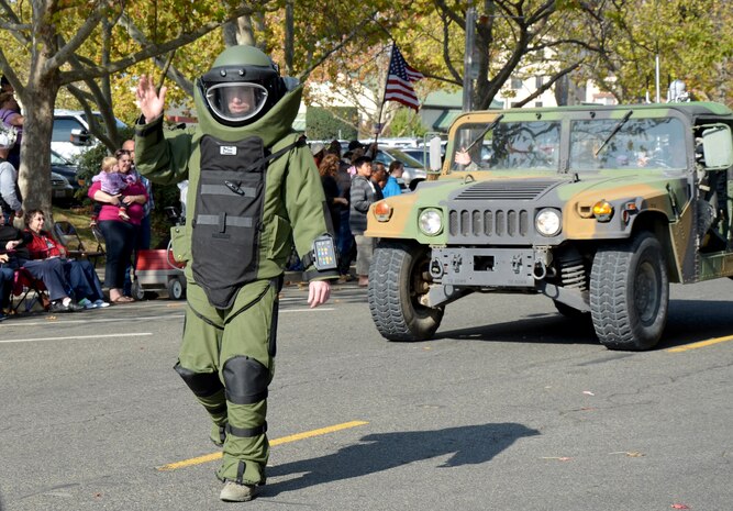 A member of the 9th Civil Engineer Squadron, Explosive Ordnance Disposal team, displays a protective suit during the Yuba-Sutter Veterans Day Parade in Marysville, Calif., Nov. 11, 2014. Veterans Day is celebrated throughout the U.S. to honor those who have served and are serving in the Armed Forces. (U.S. Air Force photo by Staff Sgt. Robert M. Trujillo/Released)