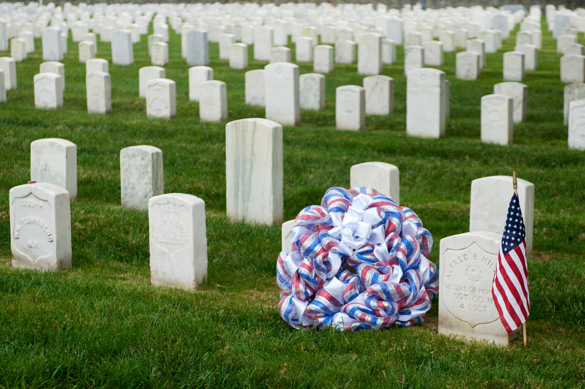 The Langley African American Heritage Council held a ceremony to honor all U.S. military veterans during a ceremony Nov. 11, 2014, at the Hampton National Cemetery in Hampton, Va. U.S. Army Col. Joseph E. Ladner, 633rd Air Base Wing vice commander, laid a wreath at the grave site of Sgt. Alfred B. Hilton, a Civil War-era Medal of Honor recipient. (U.S. Air Force photo by Senior Airman R. Alex Durbin/Released)