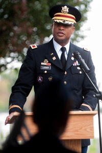 U.S. Army Col. Joseph E. Ladner, 633rd Air Base Wing vice commander, gives a speech on the importance to Veterans Day during the Langley African American Heritage Council Veterans Day wreath-laying ceremony Nov. 11, 2014, at the Hampton National Cemetery in Hampton, Va. Originally named Armistice day to honor WWI veterans, the holiday was designated as Veterans Day in 1954 to honor veterans of every conflict. (U.S. Air Force photo by Senior Airman R. Alex Durbin/Released)