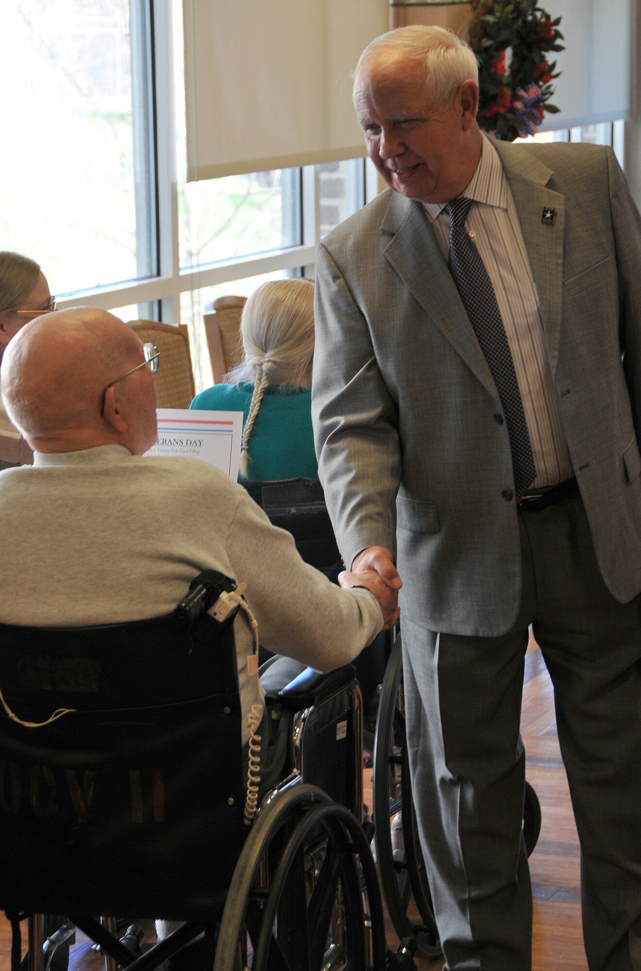 Army Reserve Ambassador Robert H. Beahm speaks with nearly 100 senior citizens – including two-dozen military veterans – during a Veterans Day ceremony Nov. 11 at the Oak Crest Village retirement community in Parkville, Md. Beahm is a graduate of the U.S. Military Academy at West Point and Vietnam War veteran who spent 30 years serving in the Army and Army Reserve before retiring as a brigadier general. For more information on the ARA program, visit http://www.usar.army.mil/community/ambassadors/Pages/default.aspx (U.S. Army photo by Staff Sgt. Shawn Morris/Released)