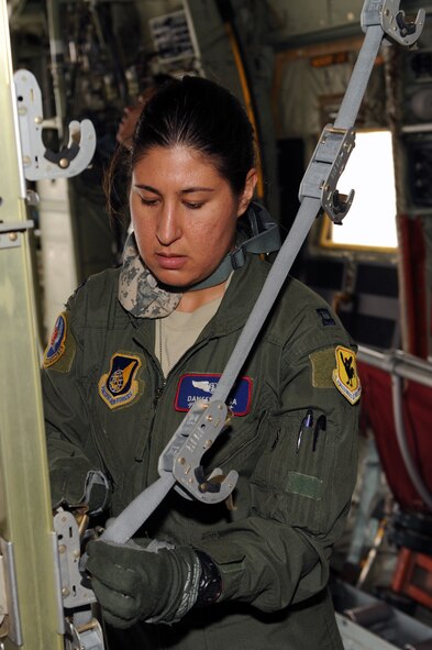 U.S. Air Force Capt. Daneen Kosa, 18th Aeromedical Evacuation Squadron flight nurse, prepares the interior of a U.S. Marine Corps C-130 to transport simulated patients in support of Keen Sword on Kadena Air Base, Japan, Nov. 12, 2014. Keen Sword allows the U.S. and Japan to practice coordination procedures and improve interoperability required to effectively defend Japan or respond to crises throughout the Asia-Pacific region. (U.S. Air Force photo by Airman 1st Class Zade C. Vadnais/Released)