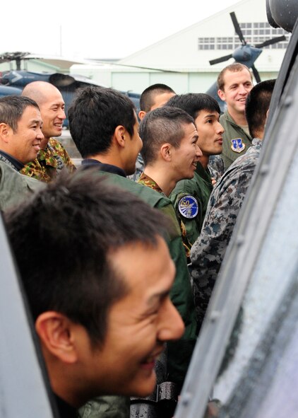 Members of Japan Air Self-Defense Force's Komatsu Air Rescue Squadron familiarize themselves with an HH-60G from Kadena Air Base's 33rd Rescue Squadron during an aircraft static display on Komatsu Air Base, Japan, Nov. 09, 2014. The 33rd and 212th Rescue Squadrons are participating in Keen Sword, a joint-bilateral training exercise, with members of the Japan Self-Defense Force. (U.S. Air Force photo by 2nd Lt. Erik Anthony/Released)