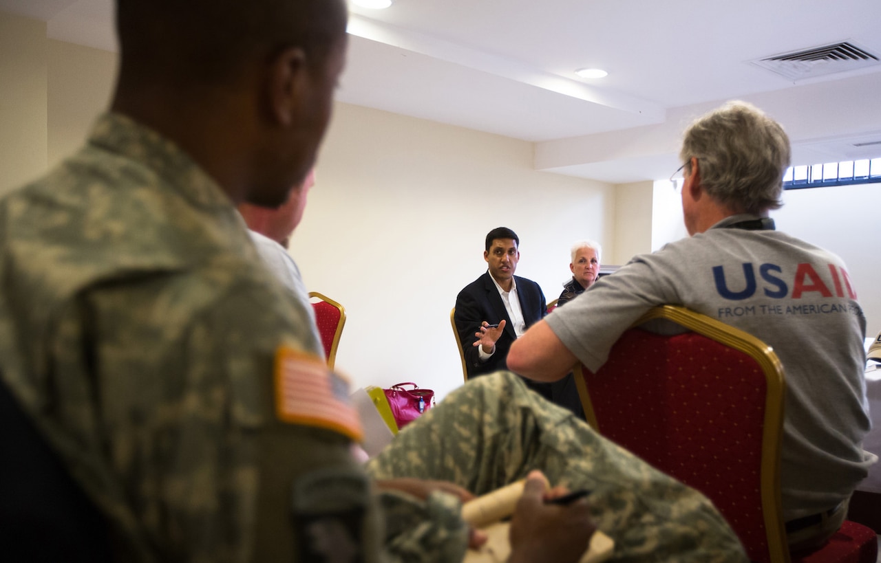 In Monrovia, Liberia, U.S. Agency for International Development Administrator Rajiv Shah meets with members of the USAID Disaster Assistance Response Team, members of the Centers for Disease Control and Prevention, and U.S. military officers about the Ebola response in Liberia, Oct. 14, 2014. USAID photo by Morgana Wingard