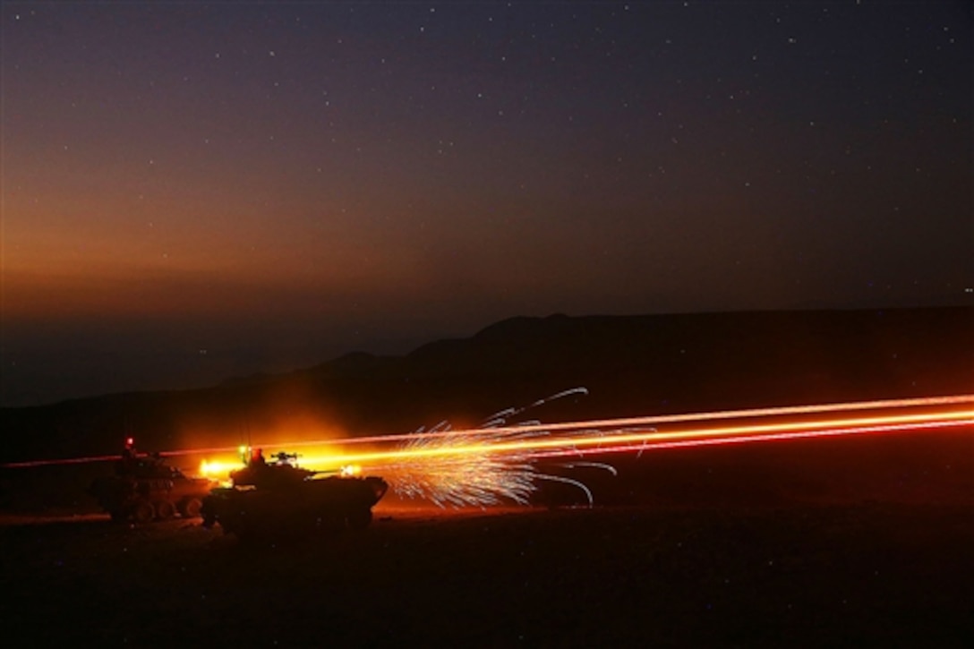 U.S. Marines fire at fixed targets from Light Armored Vehicle-25s during training in d'Arta Plage, Djibouti, Nov. 9, 2014.