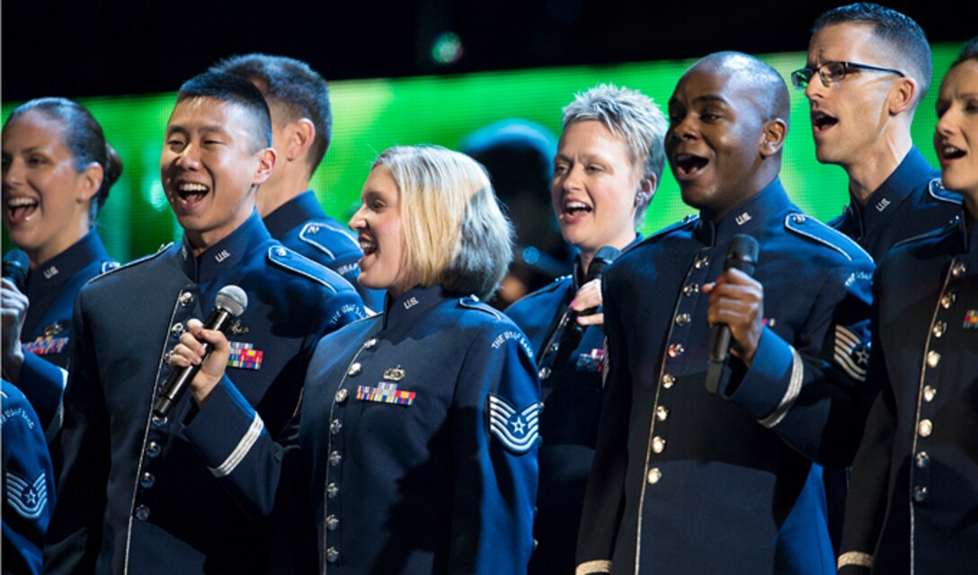 The Air Force Singing Sergeants sing behind Carrie Underwood during The Concert for Valor in Washington, D.C. Nov. 11, 2014. The Singing Sergeants are the Air Force’s premier, 23-member active-duty chorale group. (DoD News photo/EJ Hersom)