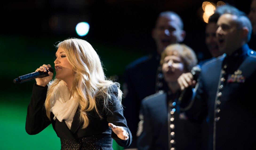 The Air Force Singing Sergeants sing chorus for Carrie Underwood Nov. 11, 2014, during The Concert for Valor in Washington, D.C. The Singing Sergeants are the Air Force’s premier, 23-member active-duty chorale group. (DoD News photo/EJ Hersom)