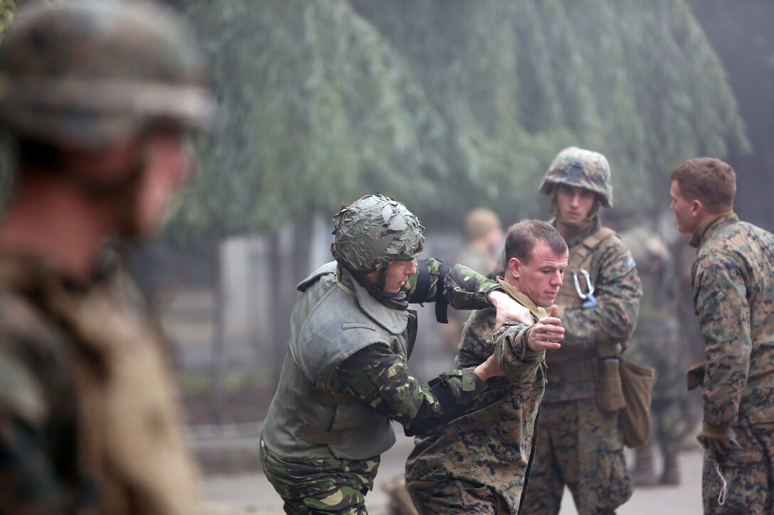 Marines of Black Sea Rotational Force 14 and Romanian soldiers conduct personnel searching and detaining classes during exercise Platinum Lynx 15.3 in Focsani, Romania. Training included weapons familiarization classes, live-fire ranges and call-for-fire ranges, among more. (U.S. Marine Corps photo by Lance Cpl. Ryan Young/released)