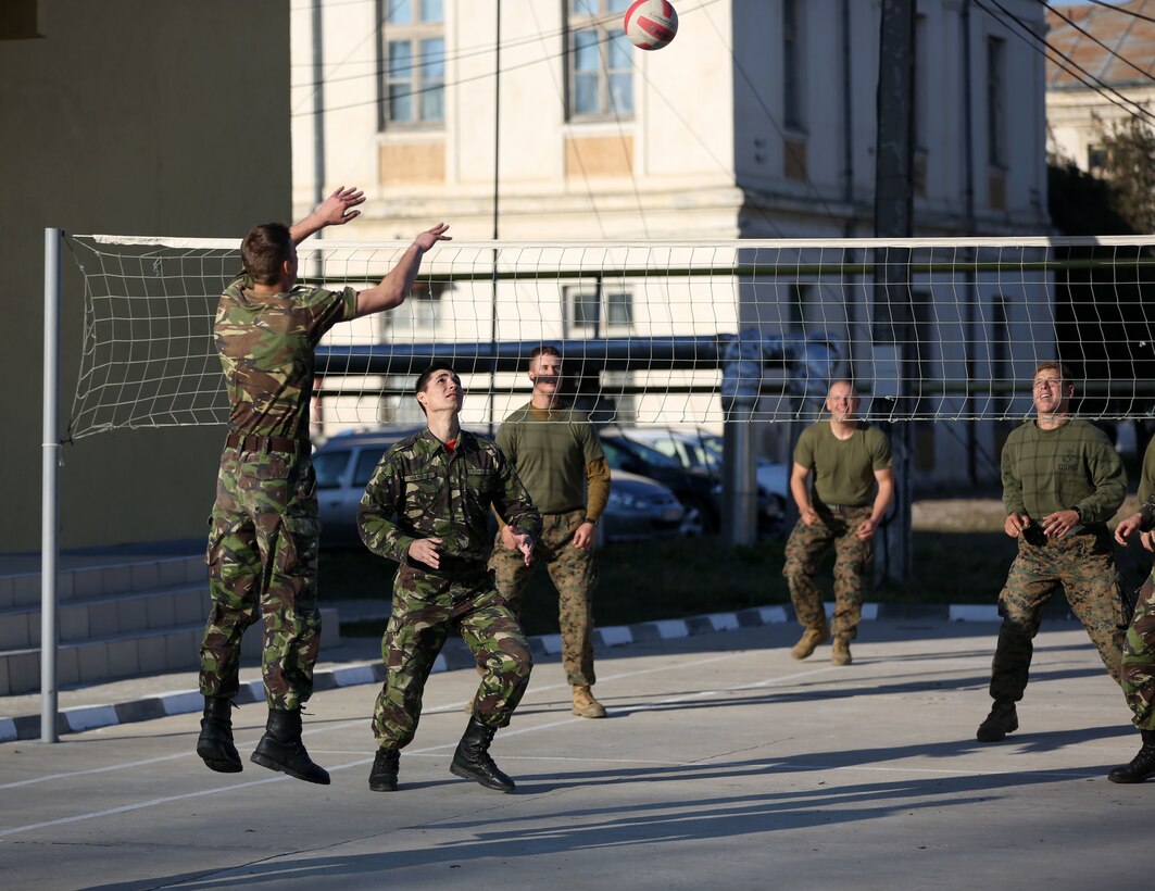 Marines play volleyball with their Romanian partners during exercise Platinum Lynx 15.3 in Focsani, Romania. Marines and Sailors on BSRF 14 worked hand-in-hand with Romanian Land Forces during the exercise (U.S. Marine Corps photo by Lance Cpl. Ryan Young/released)