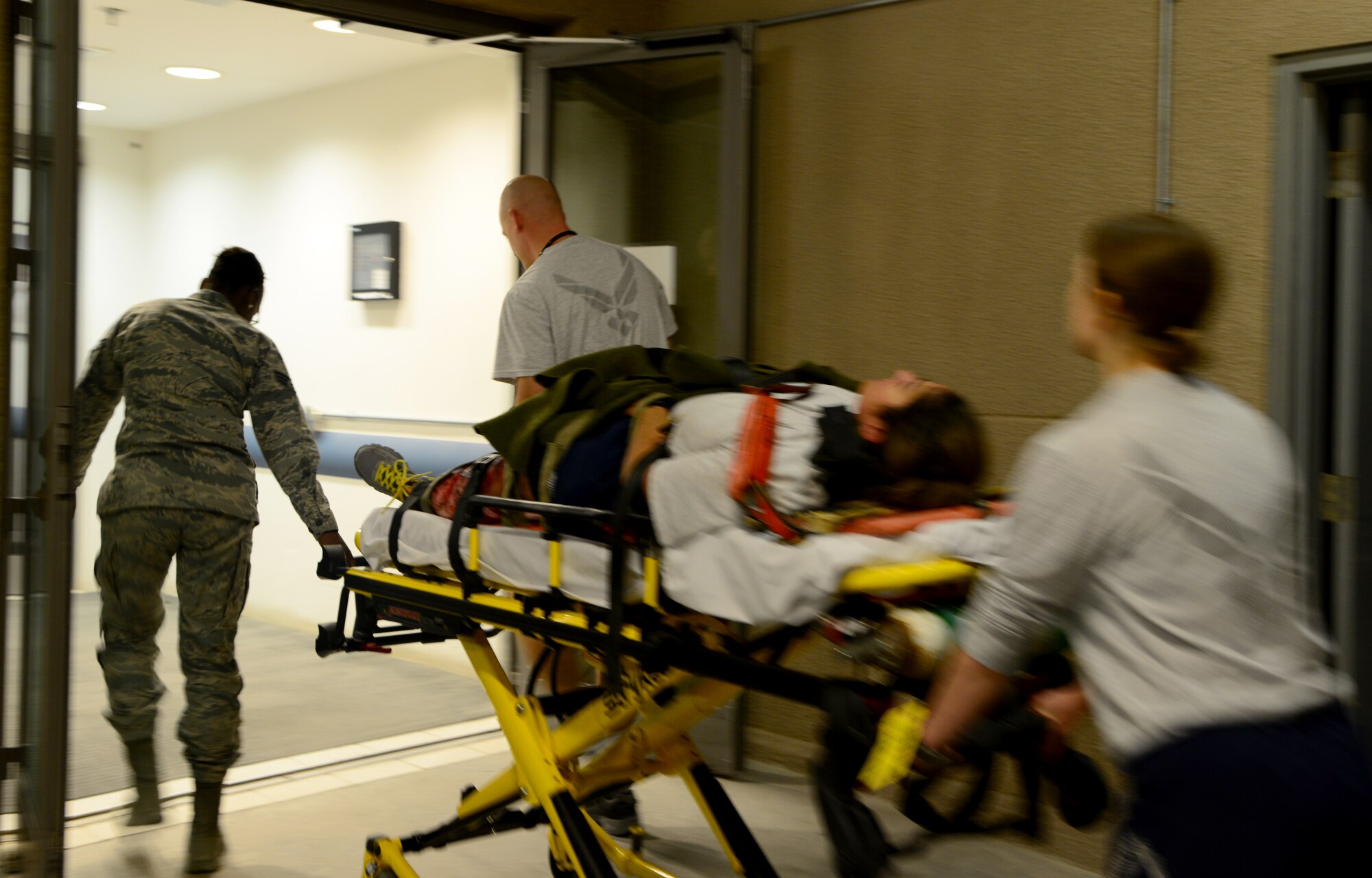 U.S. Air Force Airmen from the 379th Expeditionary Medical Group push a simulated victim of a vehicle accident on a crash cart during a mass casualty exercise Nov. 10, 2014, at Al Udeid Air Base, Qatar. Exercises such as these keep Airmen mission-ready so they can better react to a real-world scenario. The training provided by these types of exercises keep Airmen ready to respond to real-world scenarios at a moment’s notice. (U.S. Air Force photo by Senior Airman Kia Atkins) 