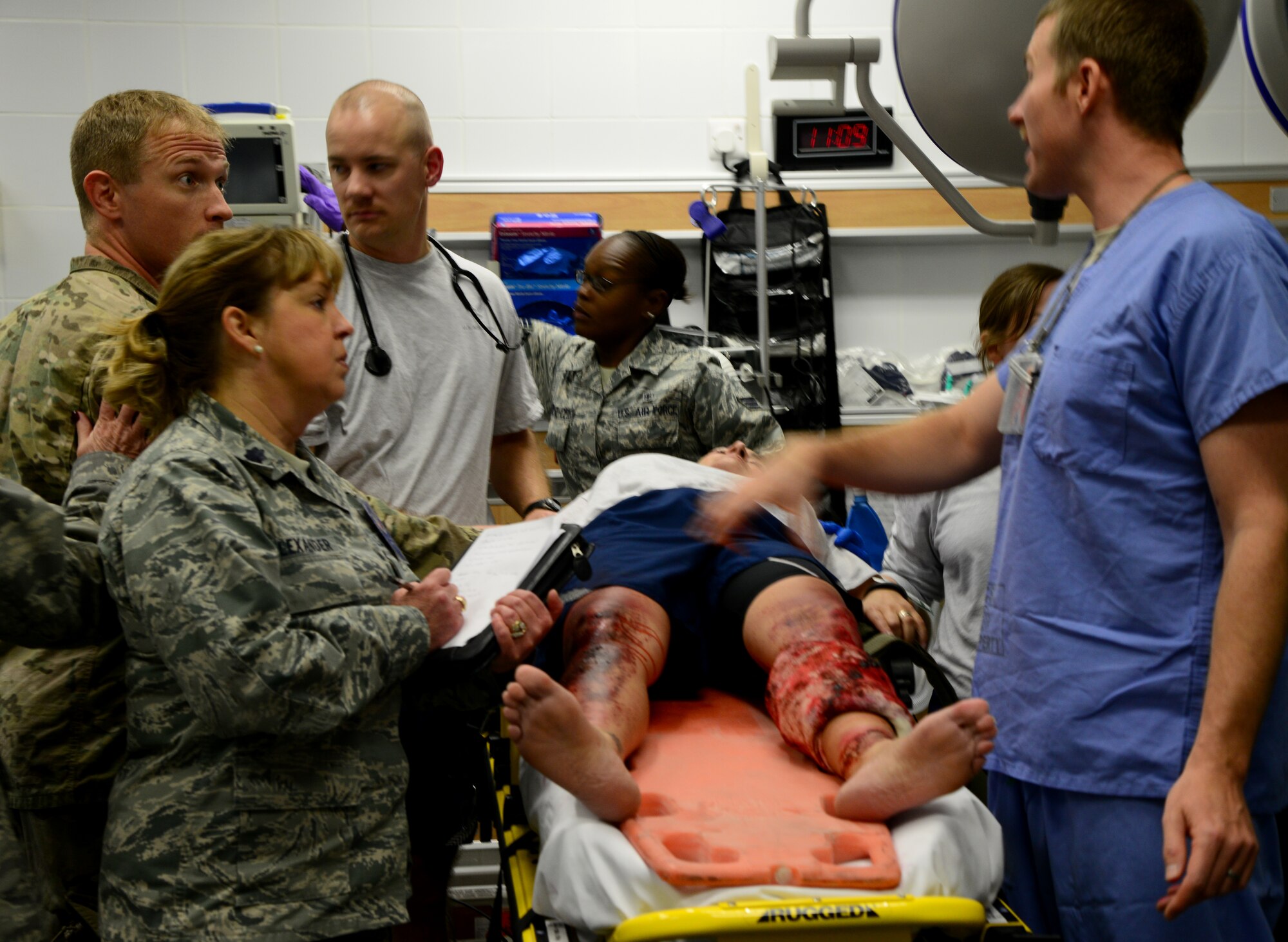 U.S. Air Force Airmen from the 379th Expeditionary Medical Group tend to a simulated victim of a vehicle accident during a mass casualty exercise Nov. 10, 2014, at Al Udeid Air Base, Qatar. The training provided by these types of exercises keep Airmen ready to respond to real-world scenarios at a moment’s notice. (U.S. Air Force photo by Senior Airman Kia Atkins). 