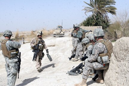 Soldiers with the 162nd Engineer Company, 105th Engineer Battalion of the Oregon National Guard take a break during a short halt from a patrol near Laki, Garmsir District, Helmand province, Afghanistan, Feb. 15, 2010. Soldiers from the 162nd Engineer Company worked to clear Route "Cowboys" in 2nd Battalion, 2nd Marine Regiment's area of operations of IEDs through three days of meticulous searching