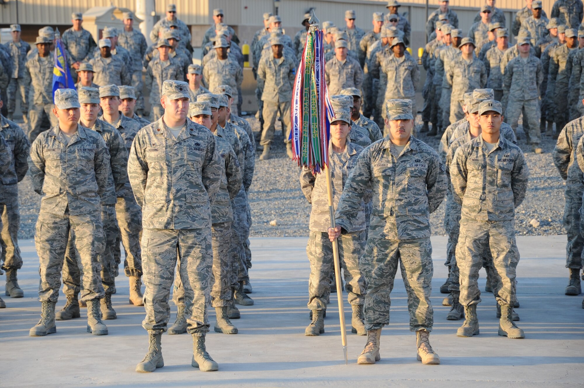 The 386th Air Expeditionary Wing Honor Guard lowers the flag during a Veteran’s Day retreat ceremony here Nov. 11, 2014. The Air Force Sergeants Association Satellite Chapter 1674 sponsored the ceremony as its inaugural event here. (U.S. Air Force photo by Master Sgt. Eric Petosky/released