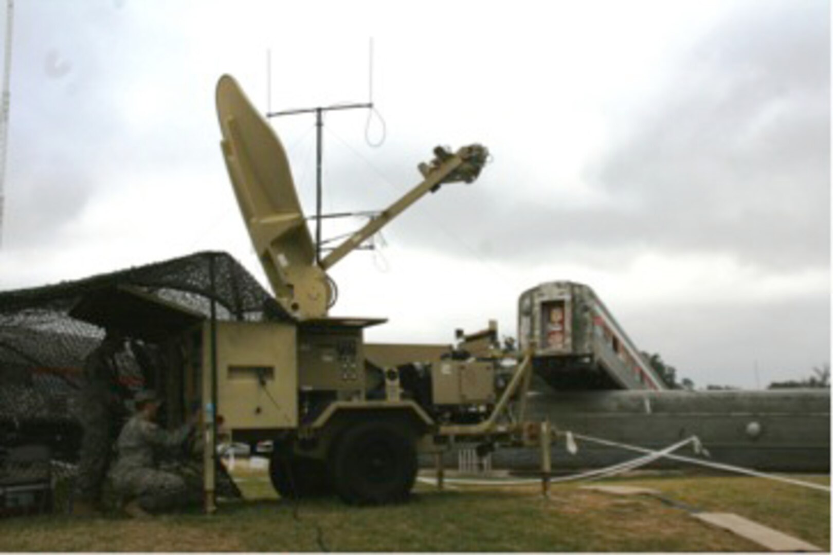 This Satellite Transportable Terminal (STT) and 4G LTE Cellular/Wireless transmission antenna in the background are part of the Disaster Incident Response Emergency Communications Terminal (DIRECT) equipment package that is being fielded to the Army National Guard to provide collaboration and communication services at incident sites that link local responders and emergency managers with state and federal authorities. The system was demonstrated on Oct. 29, 2014, in College Station Texas at Texas A&M Engineering Extension Services’ Disaster City, a realistic disaster environment that supports training exercises and testing of new equipment for first responders. 