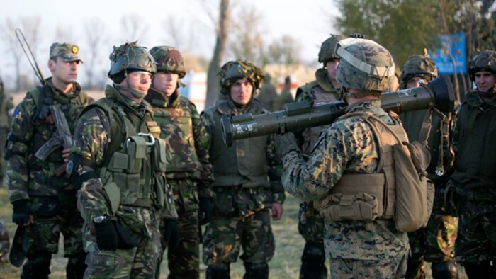 A Marine from Black Sea Rotational Force 14 explains how to use an AT4 to Romanian soldiers during Platinum Lynx 15.3. Marines and Sailors on BSRF 14 worked hand-in-hand with Romanian Land Forces during exercise Platinum Lynx 15.3 in Focsani, Romania. Training included weapons familiarization classes, live-fire ranges and call-for-fire ranges, among more. (U.S. Marine Corps photo by Lance Cpl. Ryan Young/released)
