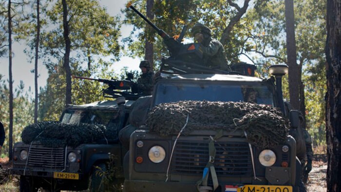 Royal Netherlands Korps Mariniers wait for orders to assault a combat town in Marine Corps Base Camp Lejeune, North Carolina on Nov. 7, 2014. This was one of the many training events of Bold Alligator 2014. A large-scale amphibious exercise on the East Coast designed to improve U.S. and allied forces response to a myriad of different crises. 