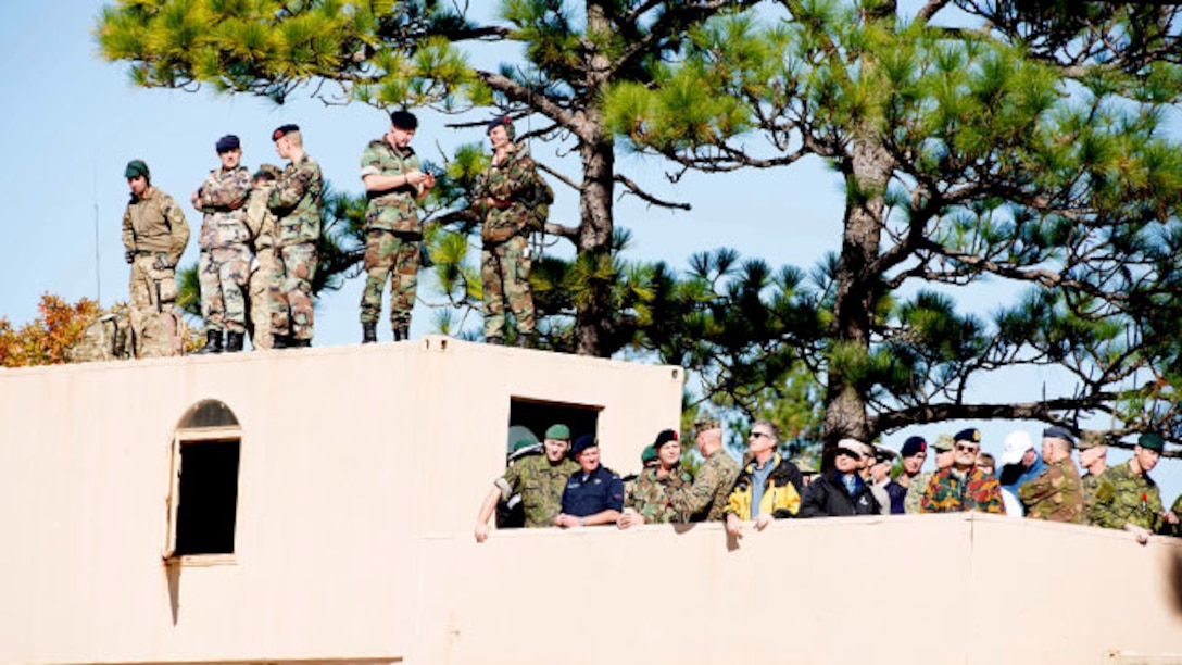 Marines and coalition forces’ leadership watch over a combat town assault in Marine Corps Base Camp Lejeune, North Carolina on Nov. 7, 2014. This was one of the many training events of Bold Alligator 2014. A large-scale amphibious exercise on the East Coast designed to improve U.S. and allied forces response to a myriad of different crises. Allies from Canada, the United Kingdom, the Netherlands, Spain and Italy participated in the assault.