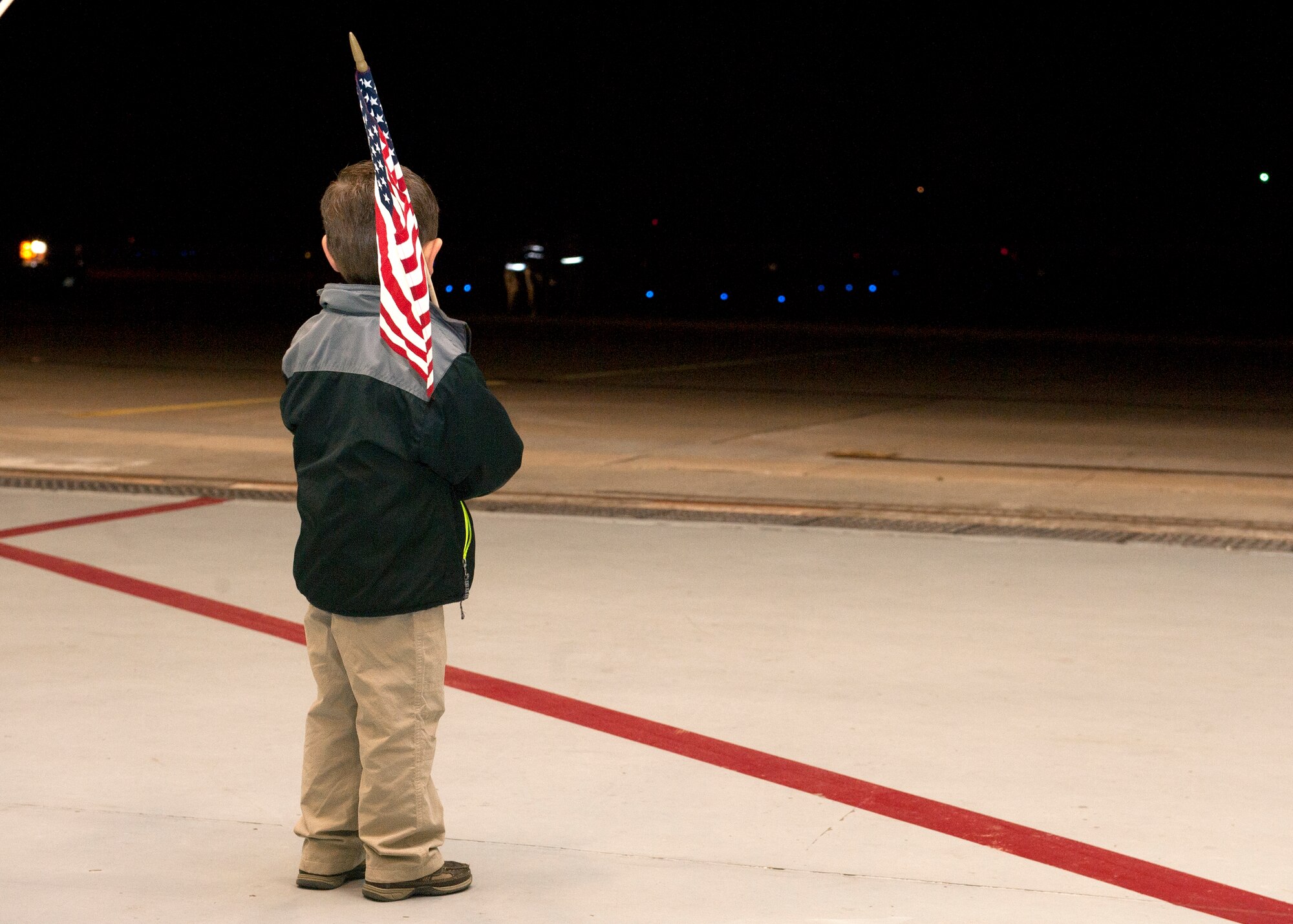 Elijah Jones, age five, waits for his father to return from his deployment during Operation Homecoming at Hurlburt Field, Fla., Nov. 7, 2014. Family and friends were among the first to greet returning Air Commandos. (U.S. Air Force photo/Senior Airman Kentavist P. Brackin)