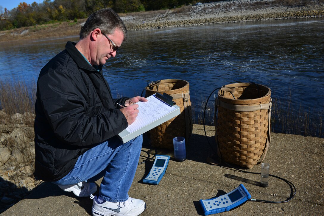 Mark Campbell, a hydrologist in the Water Management Section, Nashville District logs data collected by two water quality multi-parameters Monday, Nov. 10, 2014 at the J. Percy Priest Dam  during a test of the dam's hydro power generator.