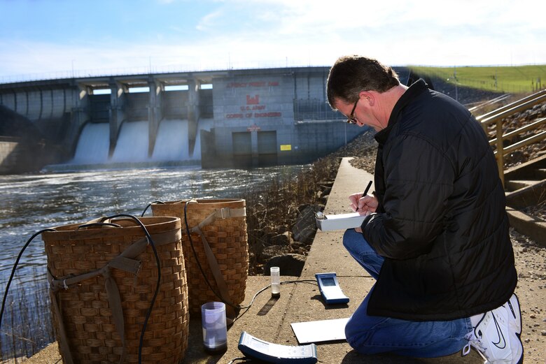 Mark Campbell, a hydrologist in the Water Management Section, Nashville District logs data collected by two water quality multi-parameters Monday, Nov. 10, 2014 at the J. Percy Priest Dam  during a test of the dam's hydro power generator.   