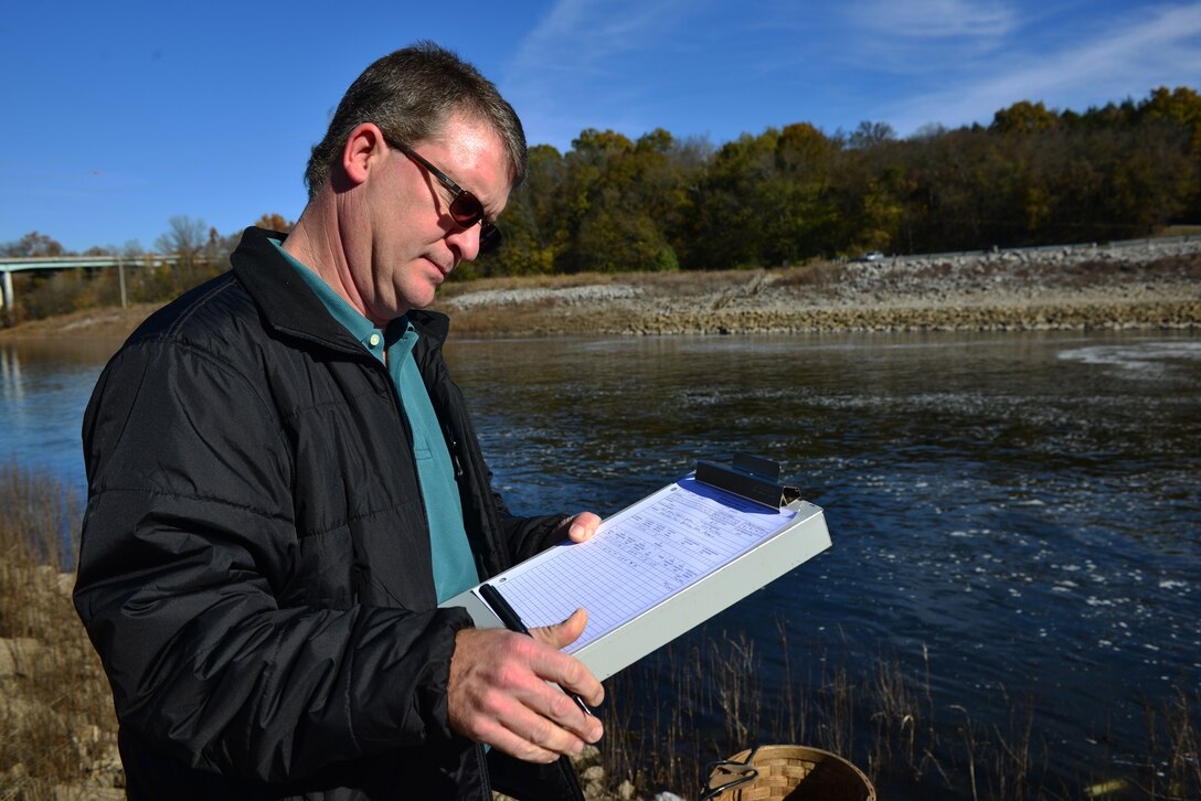 Mark Campbell, a hydrologist in the Water Management Section, Nashville District logs data collected by two water quality multi-parameters Monday, Nov. 10, 2014 at the J. Percy Priest Dam  during a test of the dam's hydro power generator.   