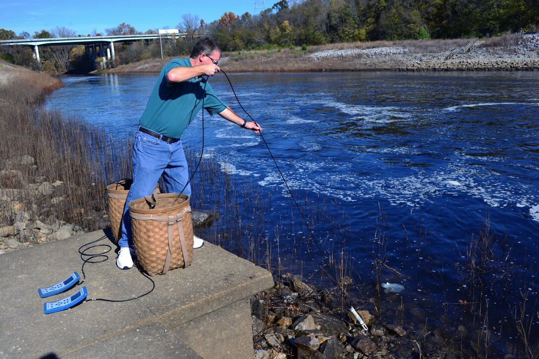 Mark Campbell, a hydrologist in the Water Management Section, Nashville District used two water quality multi-parameter signs into the tailwaters to collect, record water quality, check water temperatures, dissolved oxygen, conductivity and monitor pH levels at the J. Percy Priest Dam, Nov. 10, 2014.