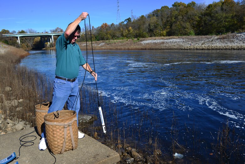 Mark Campbell, a hydrologist in the Water Management Section, Nashville District used two water quality multi-parameter signs into the tailwaters to collect, record water quality, check water temperatures, dissolved oxygen, conductivity and monitor pH levels at the J. Percy Priest Dam, Nov. 10, 2014.