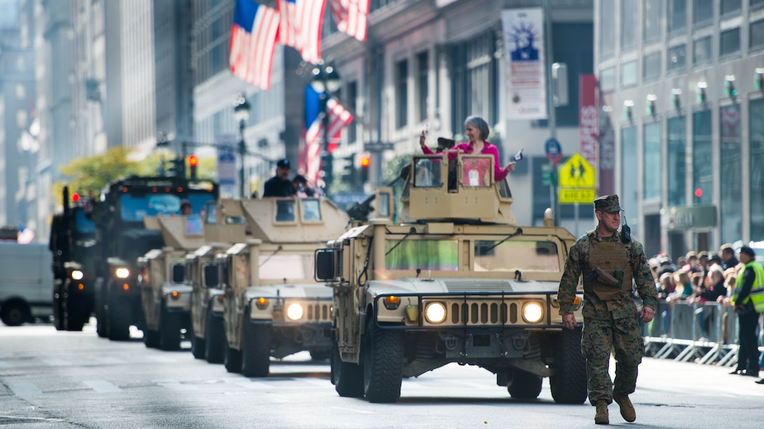 Marines operate their tactical vehicles during New York City's Veterans Day Parade November 11, 2014. The event, also known as America's Parade, highlights a different service each year. This year, the Marines were showcased for their legacy and traditions, which date back 239 years. Parade participants included Marines from 6th Communications Battalion, the Quantico Marine Corps Band, 1st Marine Corps District, and 2nd Battalion 25th Marines. 