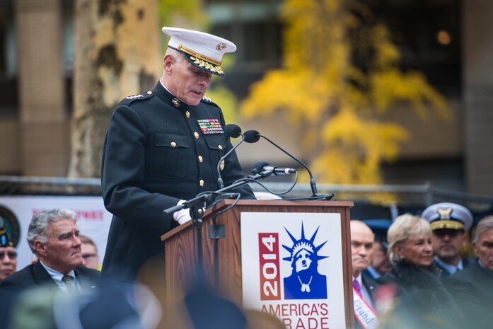 Guest of Honor Gen. John F. Kelly, Commander of U.S. Southern Command, speaks during the opening ceremony of New York City's annual Veterans Day Parade at Madison Square Park November 11, 2014. The parade, also known as America's Parade, highlights a different service each year. This year, the Marines were showcased for their legacy and traditions, which date back 239 years.