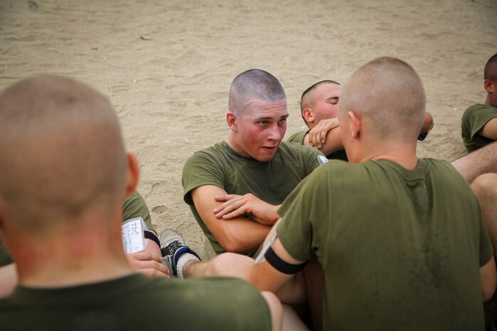Pfc. Michael R. Gama, Platoon 1074, Delta Company, 1st Recruit Training Battalion, pushes himself while performing crunches during the Physical Fitness Test aboard Marine Corps Recruit Depot San Diego, Oct. 30.  Gama endured and overcame family hardship while growing up, which solidified his decision of becoming a United States Marine