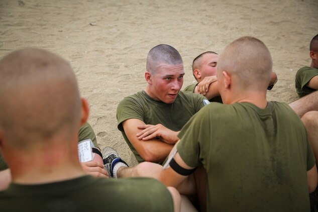Pfc. Michael R. Gama, Platoon 1074, Delta Company, 1st Recruit Training Battalion, pushes himself while performing crunches during the Physical Fitness Test aboard Marine Corps Recruit Depot San Diego, Oct. 30.  Gama endured and overcame family hardship while growing up, which solidified his decision of becoming a United States Marine