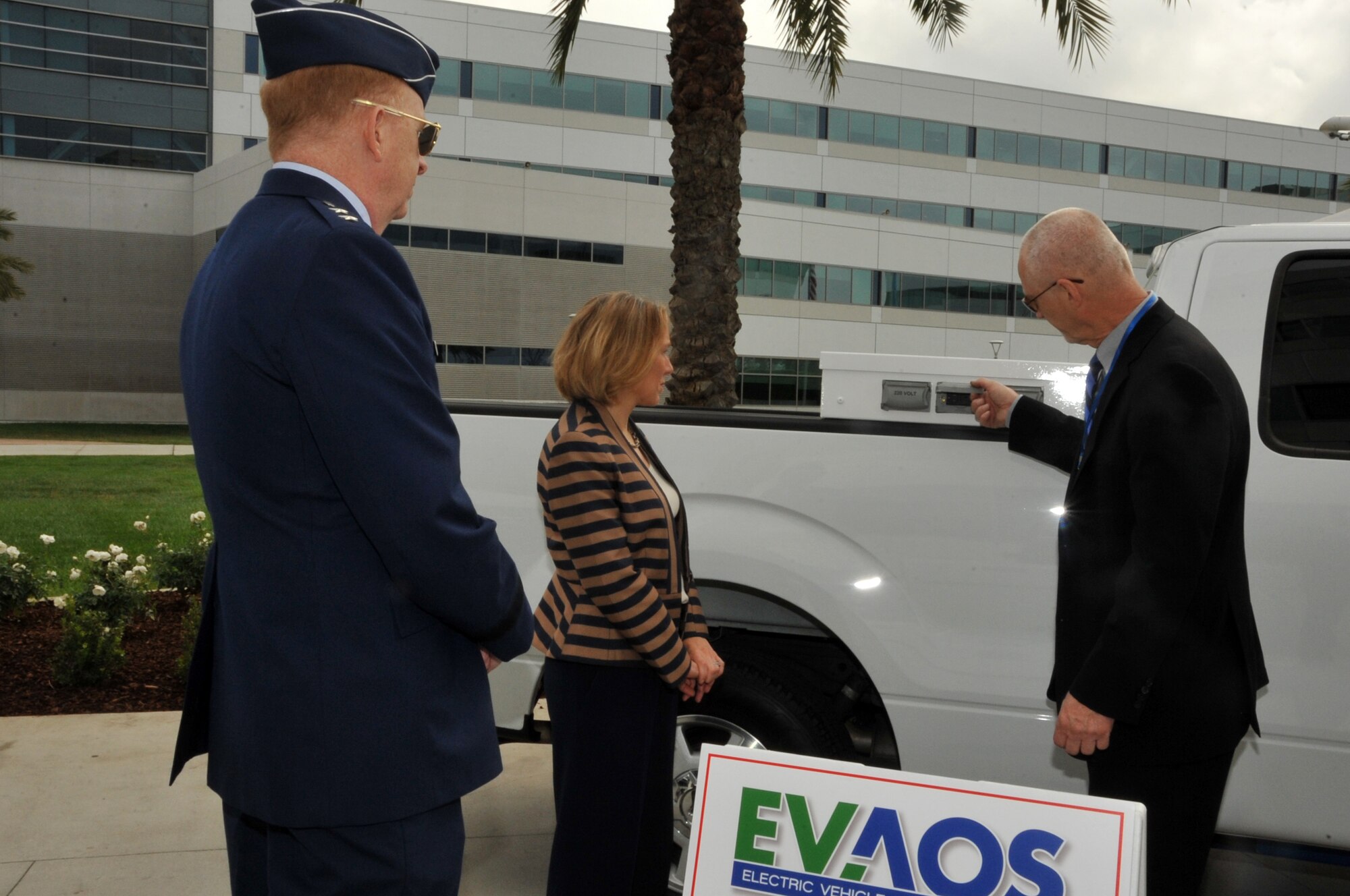 Miranda Ballentine greets vendors during the unveiling of the first federal facility to replace its entire general-purpose fleet with plug-in electric vehicles Nov. 14, 2014, at Los Angeles Air Force Base in El Segundo, Calif. The base's electric vehicle fleet, consisting of 42 vehicles, including sedans, pick-up trucks and mini vans, of which 36 will be vehicle-to-grid capable, is the largest operational V2G demonstration in the world. Ballentine is the assistant secretary of the Air Force for installations, environment and energy. (U.S. Air Force photo/Sarah Corrice)
