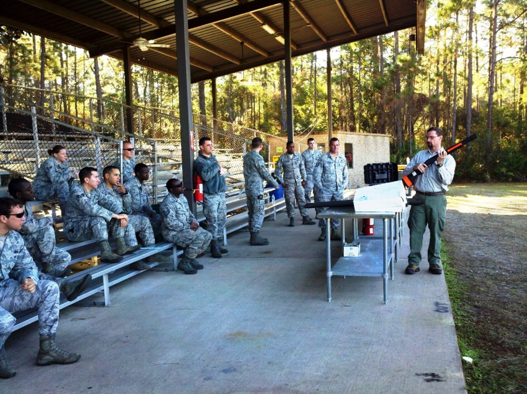 Dave Telesco, Fish and Wildlife Commission Bear Management Program coordinator, demonstrates how to use of one of the authorized methods of bear conflict management during a training class at the Dynamics of International Terrorism range on Hurlburt Field, Fla. This course is offered twice a year, and in the last two years approximately 125 members of the 1st Special Operations Security Forces Squadron have been trained on how to properly deal with bear calls. (Courtesy photo)