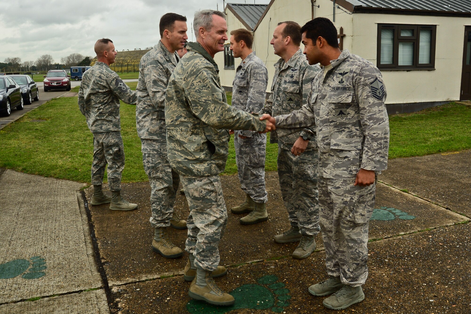 Lt. Gen. Darryl Roberson, 3rd Air Force and 17th Expeditionary Air Force commander, greets 56th Rescue Squadron Airmen at Royal Air Force Lakenheath, England, Nov. 13, 2014. During his visit, Roberson stressed the critical role the 48th Fighter Wing plays in NATO and in Europe. (U.S. Air Force photo by Airman 1st Class Erin R. Babis/Released)
