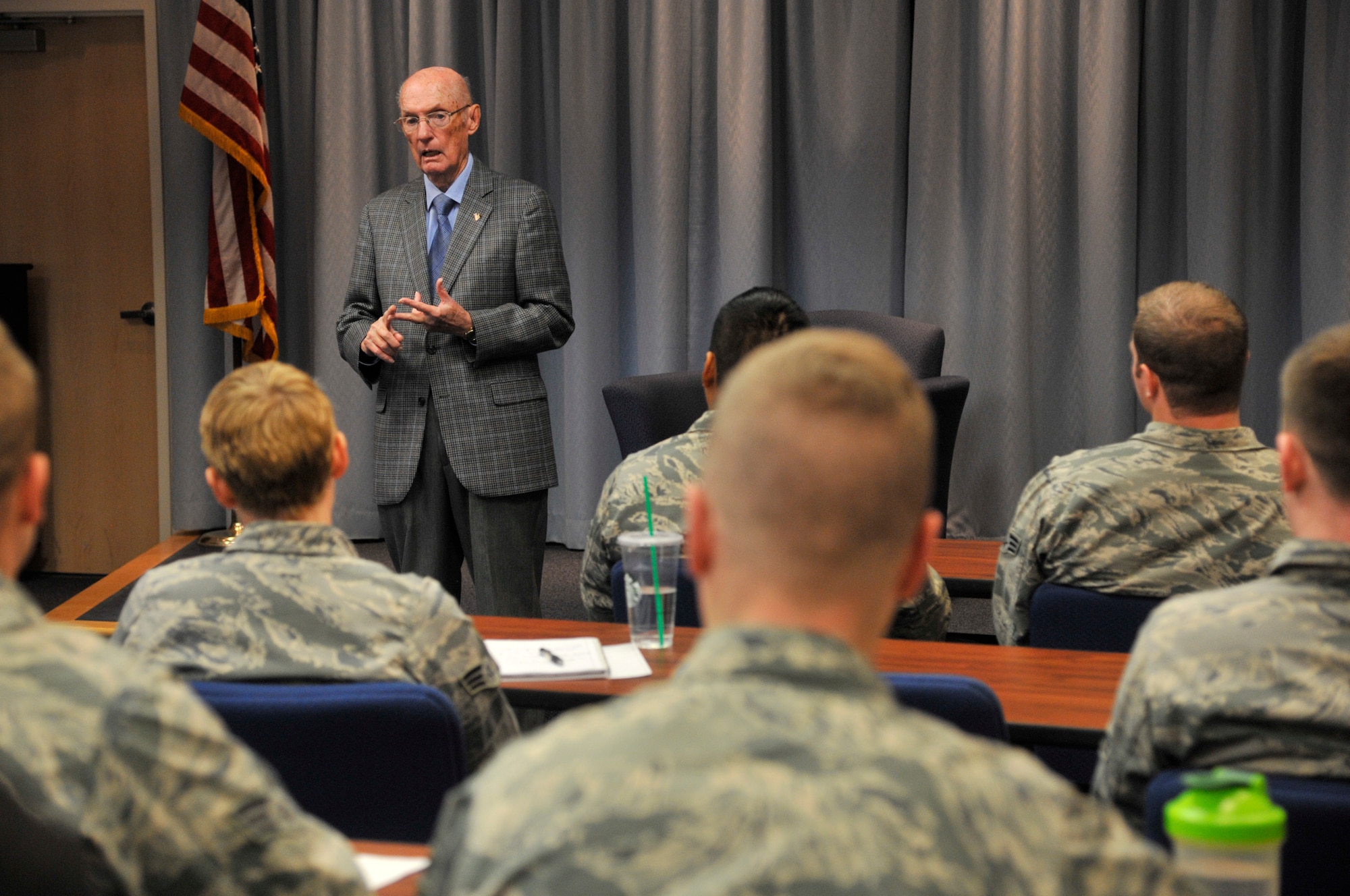 Retired Chief Master Sgt. of the Air Force James McCoy speaks with Airmen attending Airman Leadership School Nov. 12, 2014 at Fairchild Air Force Base, Wash. McCoy was the sixth CMSAF and visited Fairchild during a trip to Spokane, Wash. for Veteran's Day events. (U.S. Air Force photo/Senior Airman Mary O'Dell)