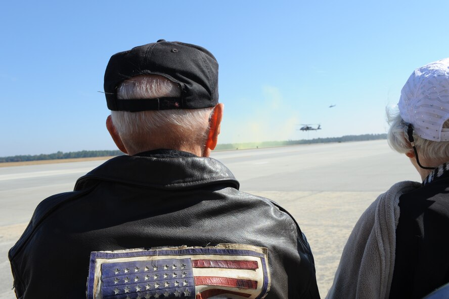 Don Miller, former 75th Fighter Squadron pilot and World War II veteran, and his wife Alice watch a Combat Search and Rescue demonstration at Moody Air Force Base, Ga., Nov. 14, 2014.  The couple visited Moody for the 2014 Flying Tiger Reunion heritage day.  (U.S. Air Force photo by Andrea Jenkins/Released)