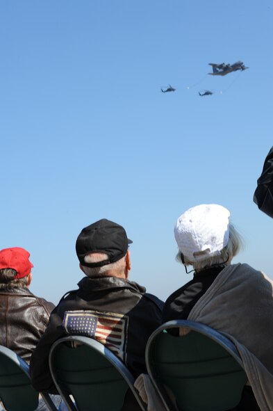 Don Miller and his wife Alice watch a Combat Search and Rescue demonstration during the 2014 Flying Tiger Reunion at Moody Air Force Base, Ga., Nov. 14, 2014.  Miller spoke with current Flying Tigers about his service during World War II.  (U.S. Air Force photo by Andrea Jenkins/Released)