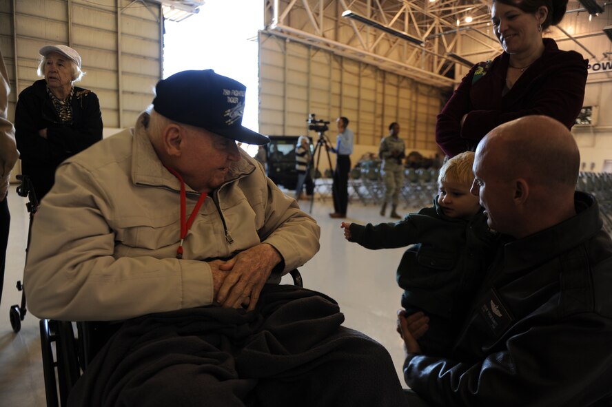 Frank Epperson, former 75th Fighter Squadron pilot and World War II veteran, talks with U.S. Air Force Lt. Col. Brian Dewitt, 23d Operations Support Squadron commander, during the 2014 Flying Tiger Reunion heritage day, Nov. 14, 2014, at Moody Air Force Base, Ga. (U.S. Air Force photo by Andrea Jenkins/Released)