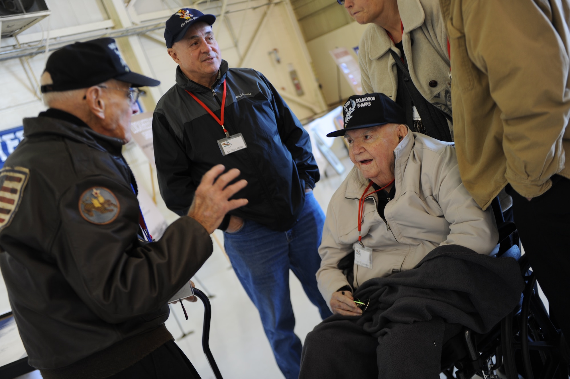 Don Miller, left, and Frank Epperson, seated, reminisce about their times as members of the 75th Fighter Squadron during World War II.  Their unit, the 75th FS, is currently located at Moody Air Force Base, Ga., and has linage to the historic Flying Tigers. (U.S. Air Force photo by Andrea Jenkins/Released)