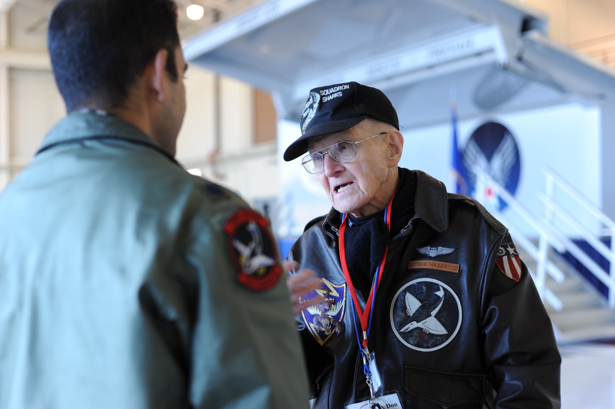 Don Miller, a former 75th Fighter Squadron pilot and World War II veteran, talks with Lt. Col. David Rayman, current 75th FS commander, during the 2014 Flying Tigers Reunion Nov. 14, 2014, at Moody Air Force Base, Ga. The Flying Tiger Reunion is a three-day event which welcomed past and present Flying Tigers to celebrate the unit’s storied history.  (U.S. Air Force photo by Andrea Jenkins/Released)