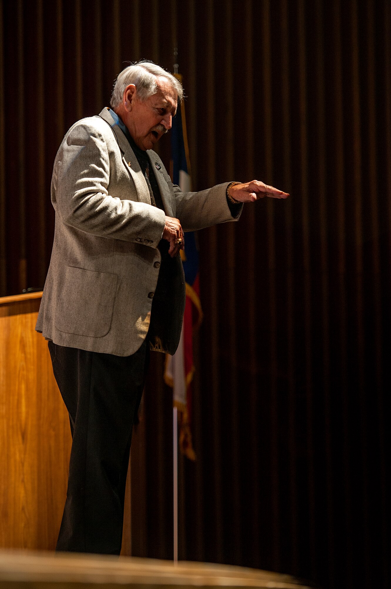 SAN ANGELO, Texas -- Retired Navy Capt. J.C. Smith, U.S. Navy Fighter Weapons School Commander, speaks during the Candlelight Vigil Ceremony at Angelo State University Nov. 12. As the guest speaker, Smith shared his experiences in life and wished the best of luck to the Air Force ROTC cadets. (U.S. Air Force photo/ Airman 1st Class Devin Boyer)